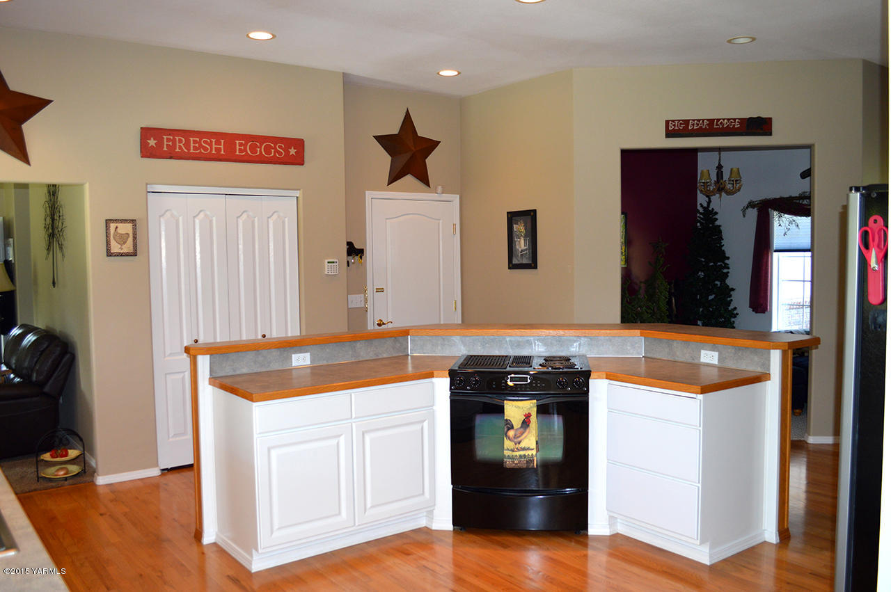 8104 Rutherford Road Yakima, WA 98903 - Photo 7 of 42 a kitchen with stainless steel appliances granite countertop a stove and a refrigerator