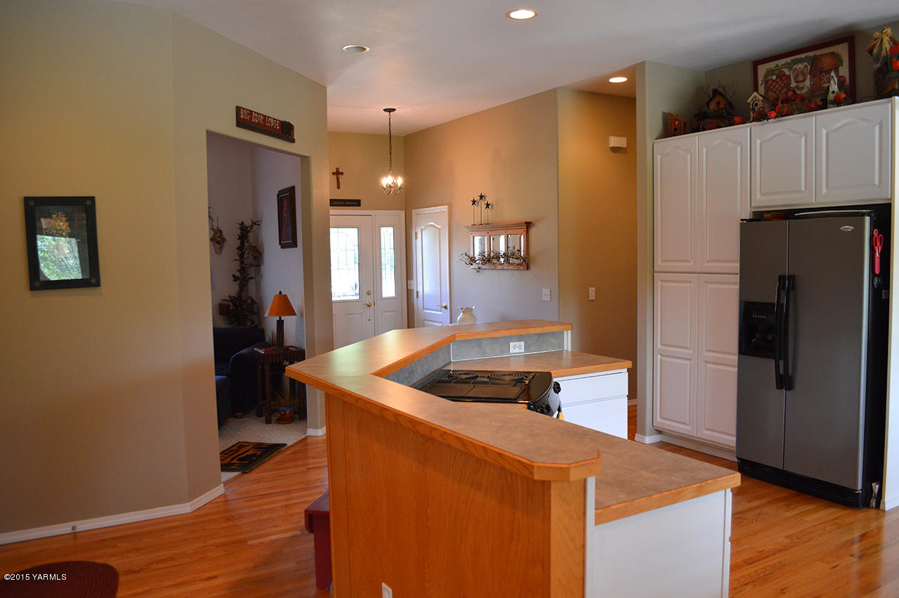 8104 Rutherford Road Yakima, WA 98903 - Photo 9 of 42 a kitchen with stainless steel appliances granite countertop a refrigerator a sink and a stove