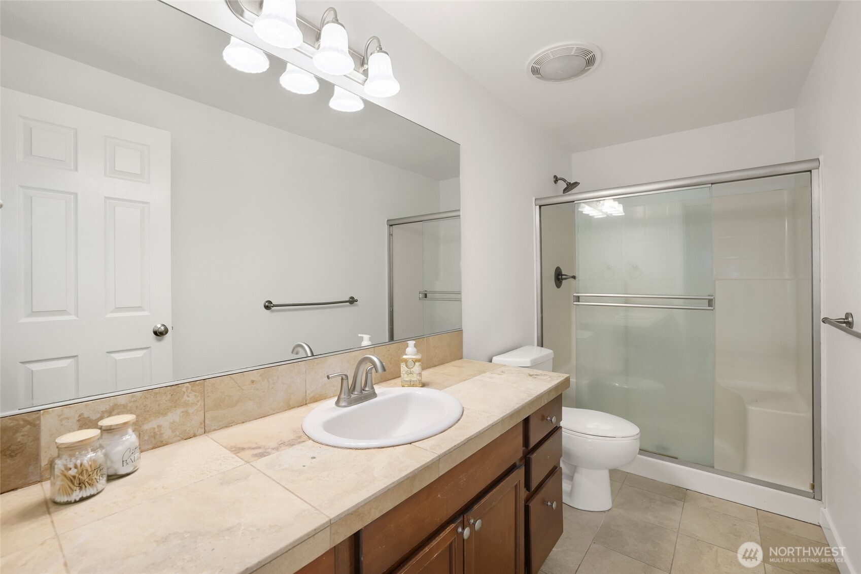 2403 B Street Steilacoom, WA 98388 - Photo 14 of 30 a bathroom with a granite countertop sink a toilet and shower