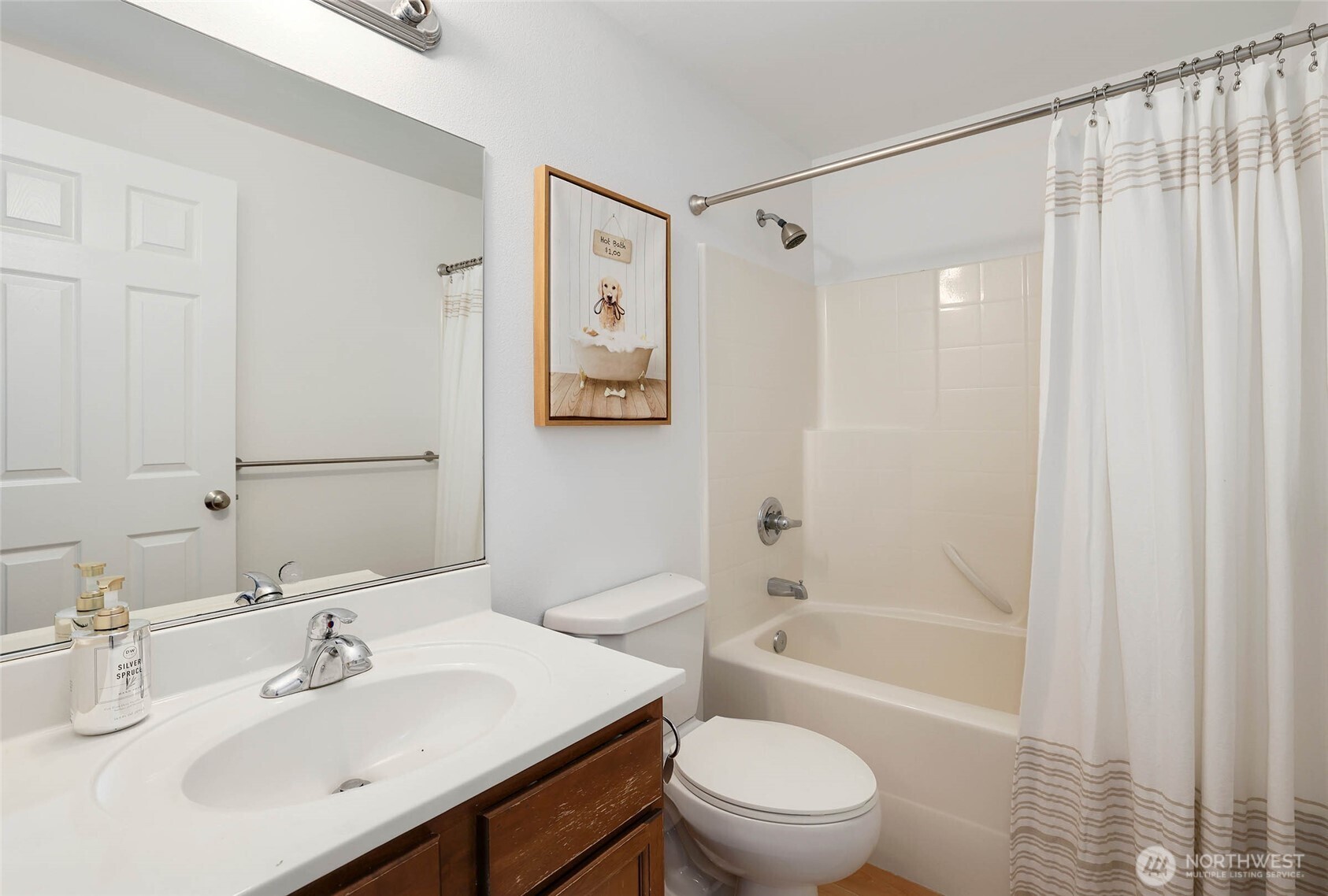 2403 B Street Steilacoom, WA 98388 - Photo 19 of 30 a bathroom with a sink toilet and shower
