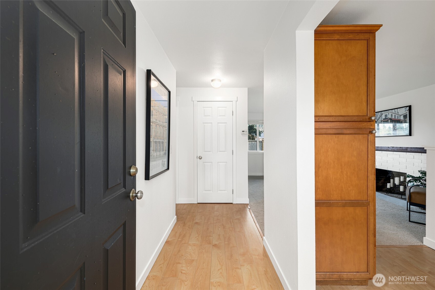 2403 B Street Steilacoom, WA 98388 - Photo 2 of 30 a view of a hallway with wooden floor and dining room view