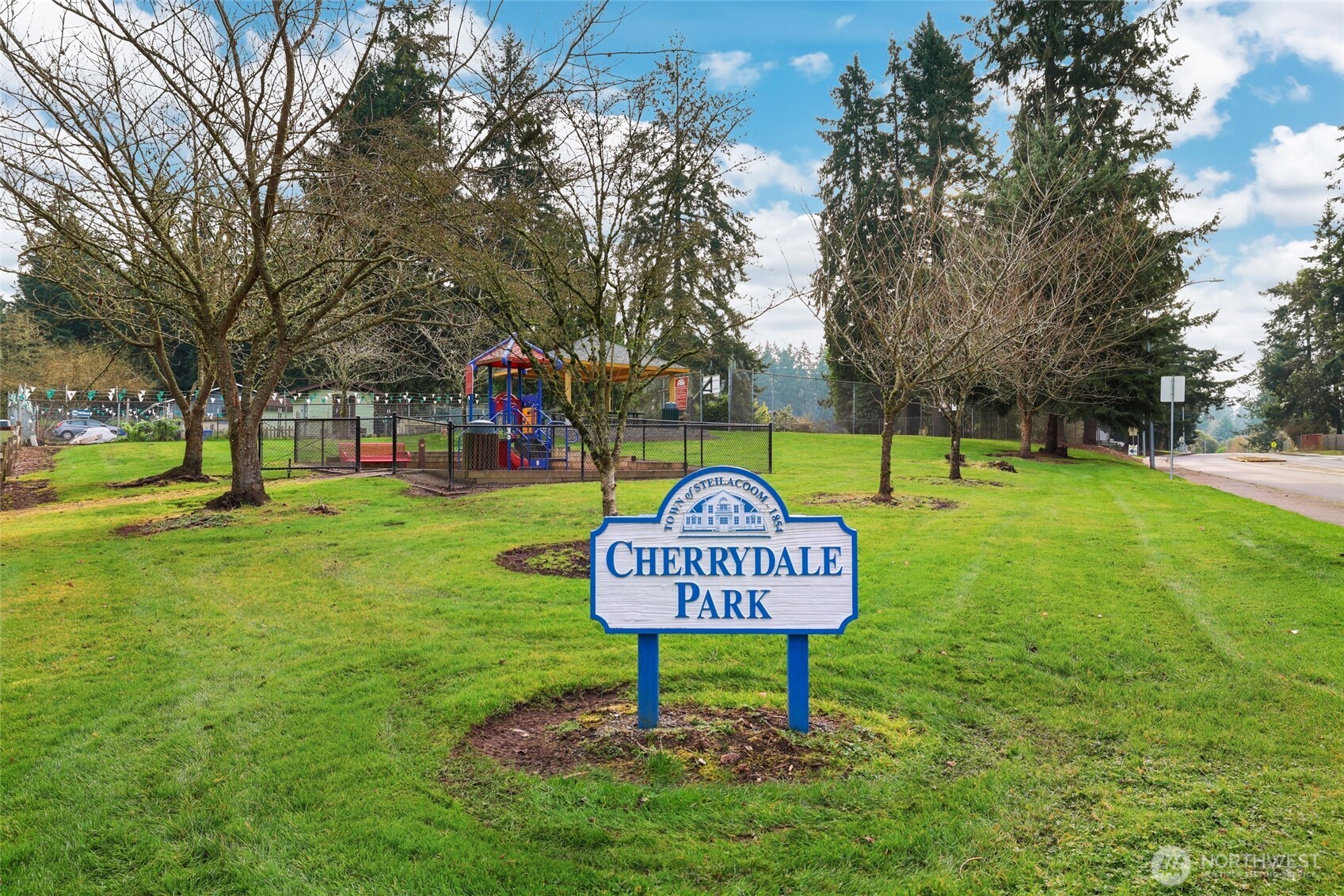 2403 B Street Steilacoom, WA 98388 - Photo 24 of 30 a view of a park with large trees
