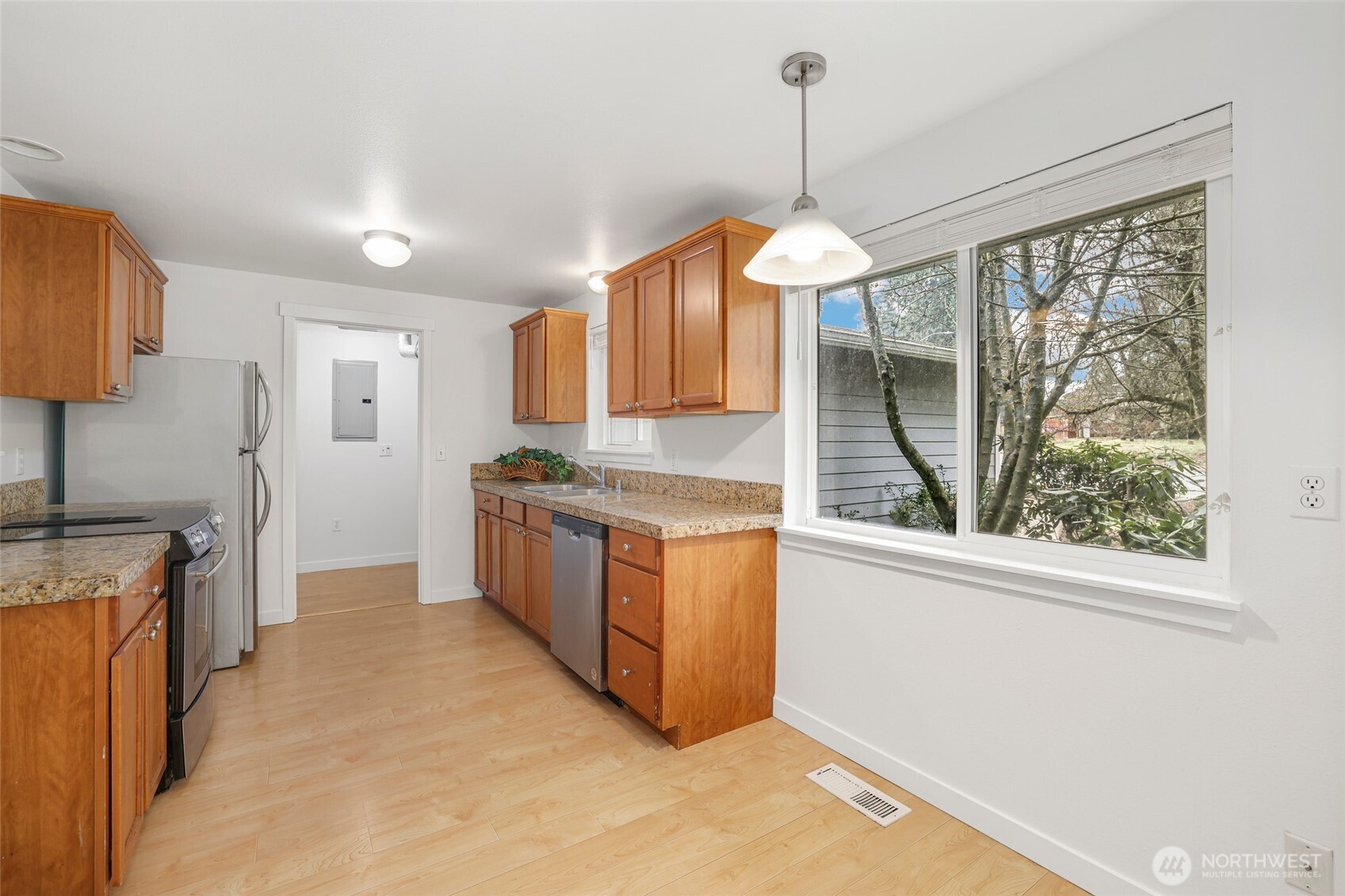 2403 B Street Steilacoom, WA 98388 - Photo 6 of 30 a kitchen with wooden floor and window