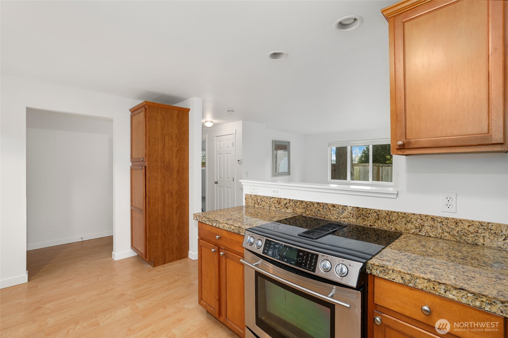 2403 B Street Steilacoom, WA 98388 - Photo 8 of 30 a kitchen with a stove and a cabinet