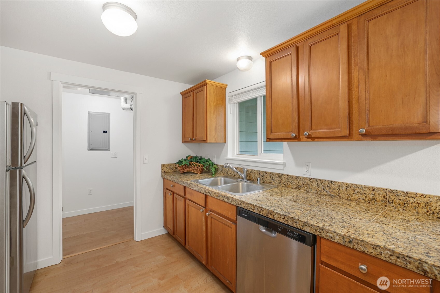2403 B Street Steilacoom, WA 98388 - Photo 9 of 30 a kitchen with stainless steel appliances granite countertop a sink a stove and a refrigerator