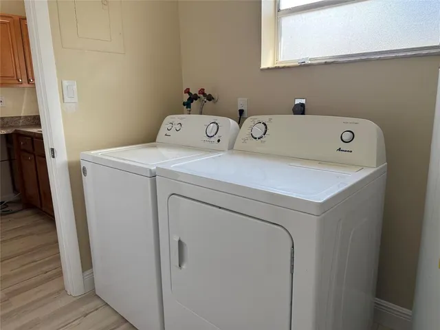 a utility room with dryer and washer
