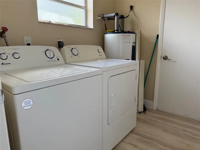 a utility room with dryer and washer