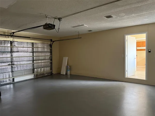 a view of a livingroom with an empty space and a window