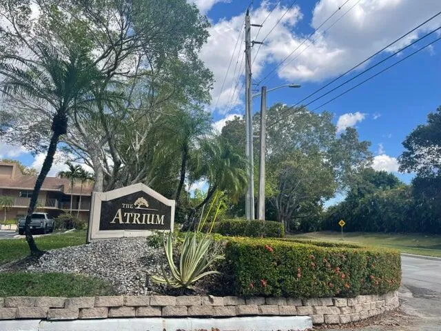 a view of a street sign of a house