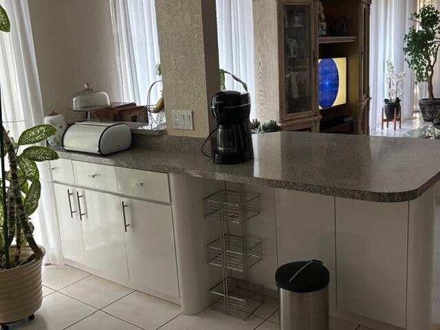 7531 Northwest 86th Terrace, Unit 101 Tamarac, FL 33321 - Photo 16 of 20 a bathroom with a sink and a mirror