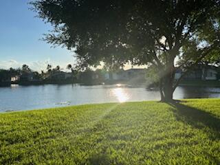 7531 Northwest 86th Terrace, Unit 101 Tamarac, FL 33321 - Photo 19 of 20 a view of a lake from a yard