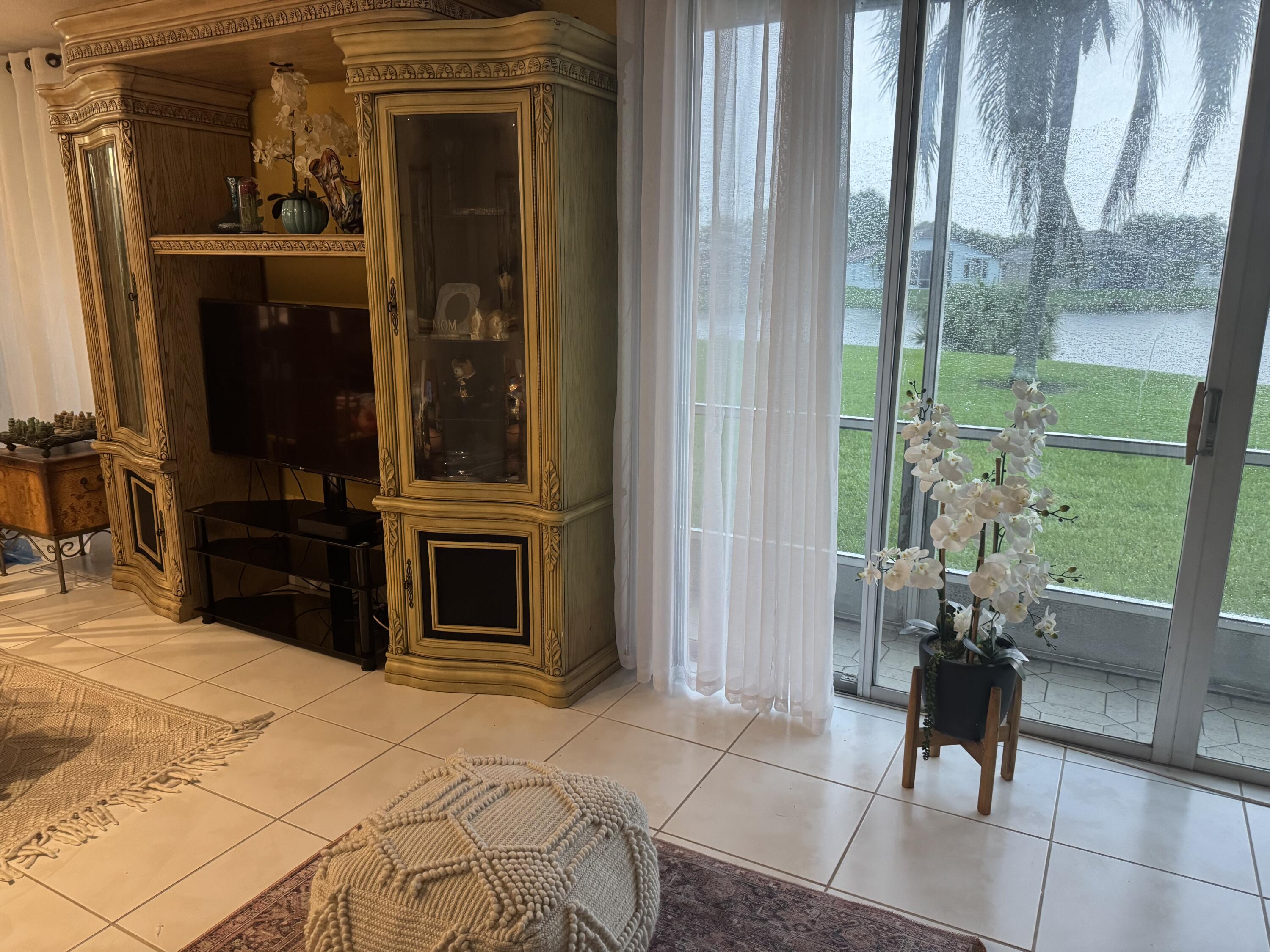 7531 Northwest 86th Terrace, Unit 101 Tamarac, FL 33321 - Photo 4 of 20 a view of an outdoor space and porch with furniture