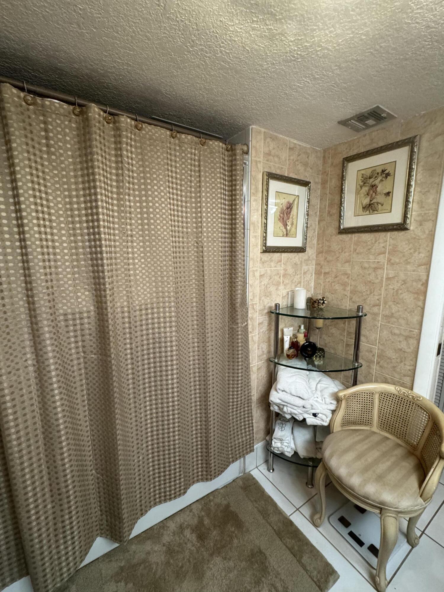 7531 Northwest 86th Terrace, Unit 101 Tamarac, FL 33321 - Photo 9 of 20 a living room with furniture and a window