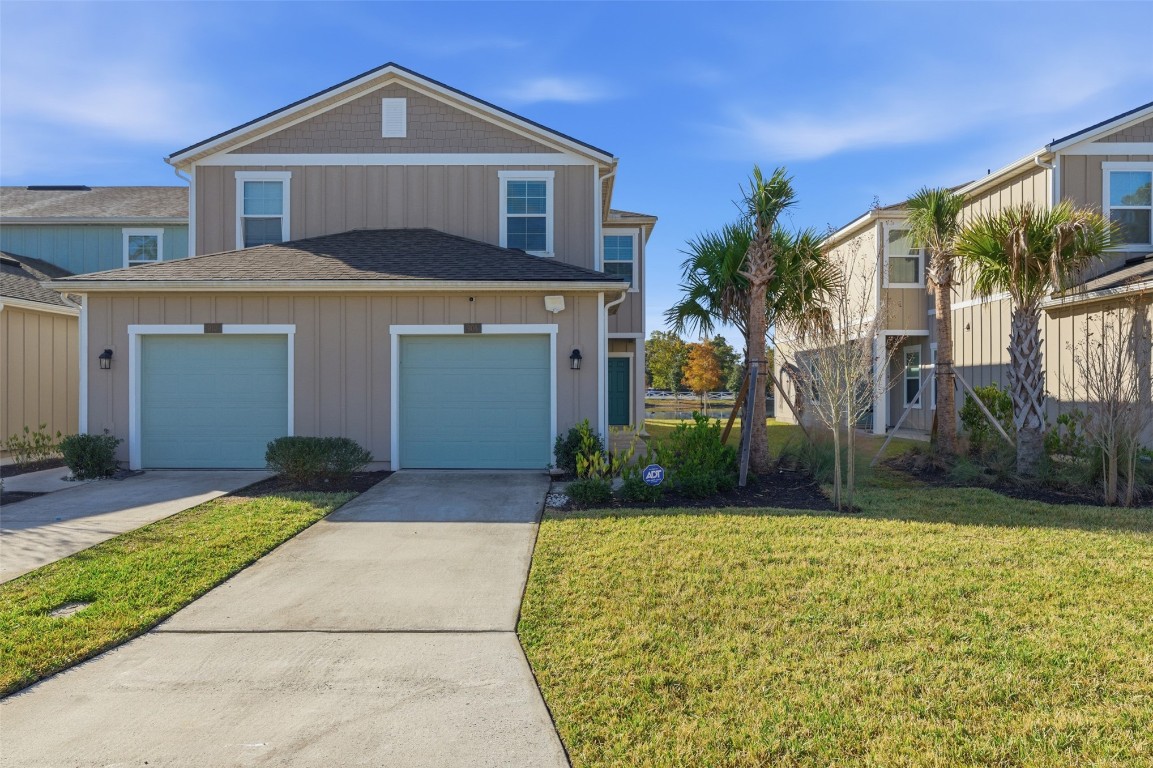 908 Observatory Parkway Jacksonville, FL 32218 - Photo 1 of 16 a front view of a house with garden