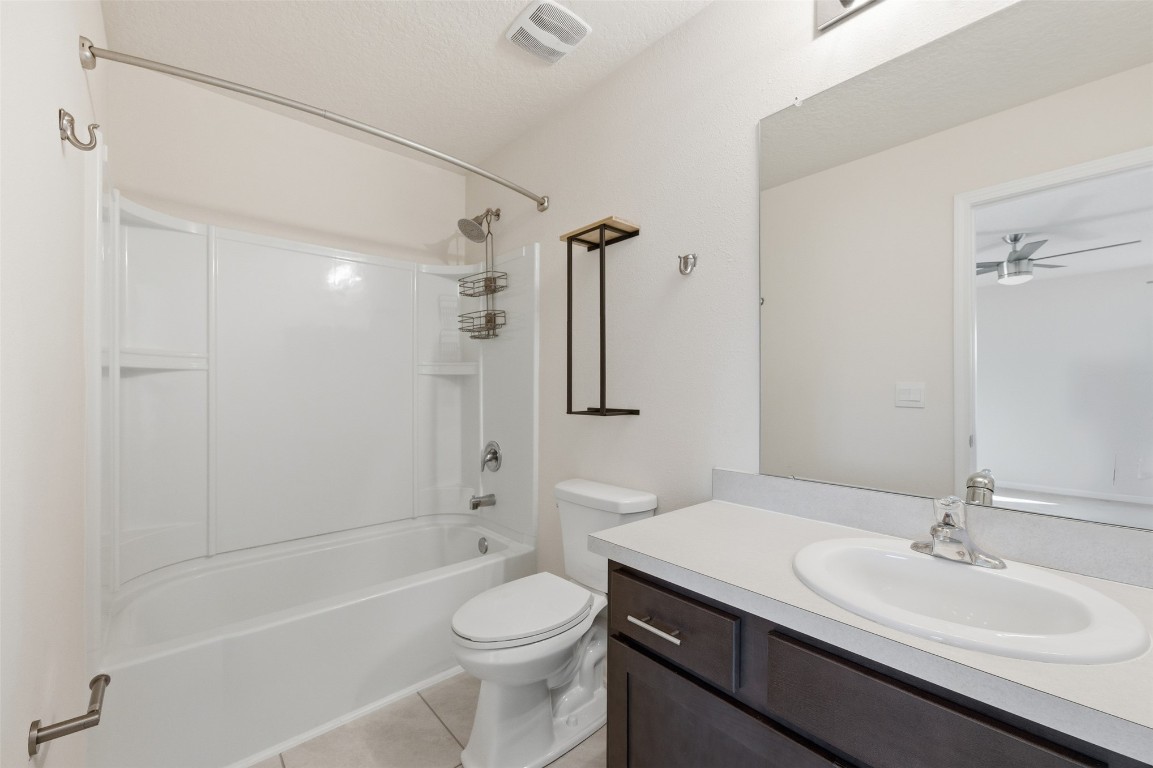 908 Observatory Parkway Jacksonville, FL 32218 - Photo 13 of 16 a bathroom with a sink a toilet a mirror and shower