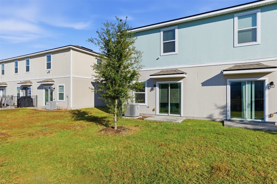 908 Observatory Parkway Jacksonville, FL 32218 - Photo 15 of 16 a view of a house with a yard