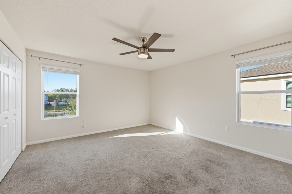 908 Observatory Parkway Jacksonville, FL 32218 - Photo 8 of 16 a view of a livingroom with a ceiling fan and window