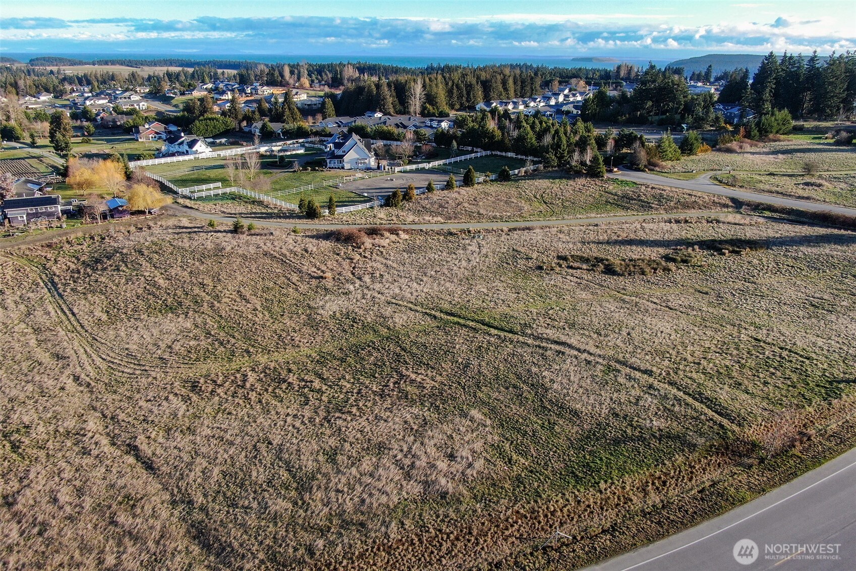 336 Bell Bottom Road Sequim, WA 98382 - Photo 2 of 29 a view of a swimming pool with lawn chairs