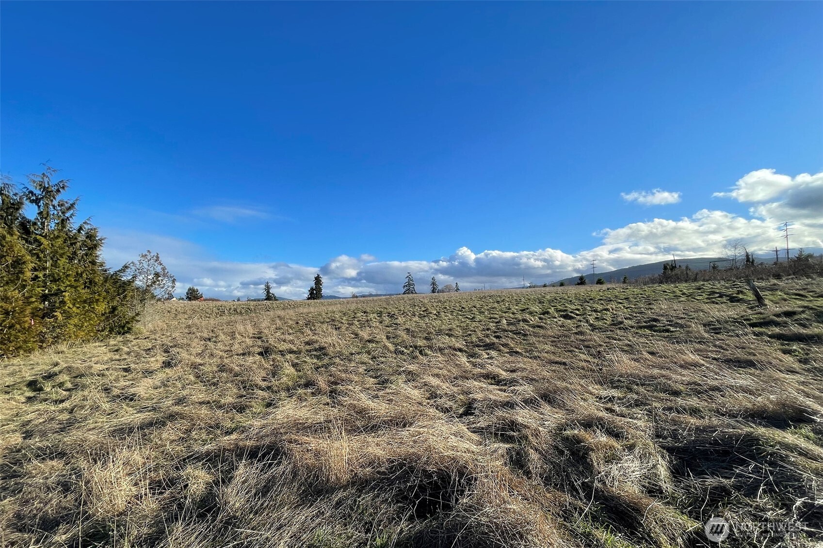 336 Bell Bottom Road Sequim, WA 98382 - Photo 24 of 29 a view of a lake with a building in the background