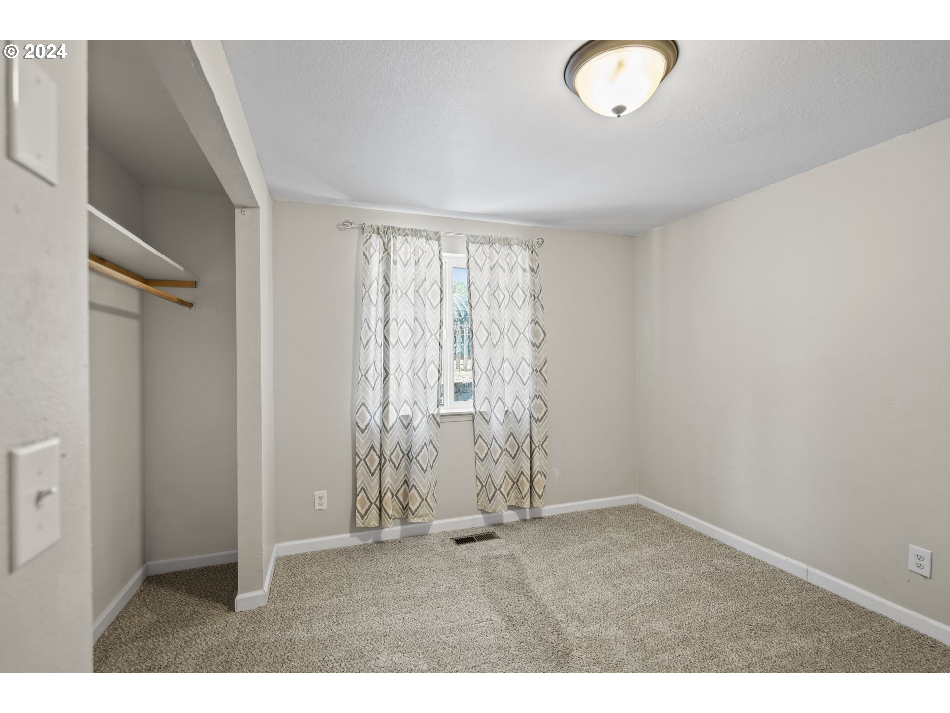 163 Christa Lane Eagle Point, OR 97524 - Photo 12 of 24 a view of an empty room with a window
