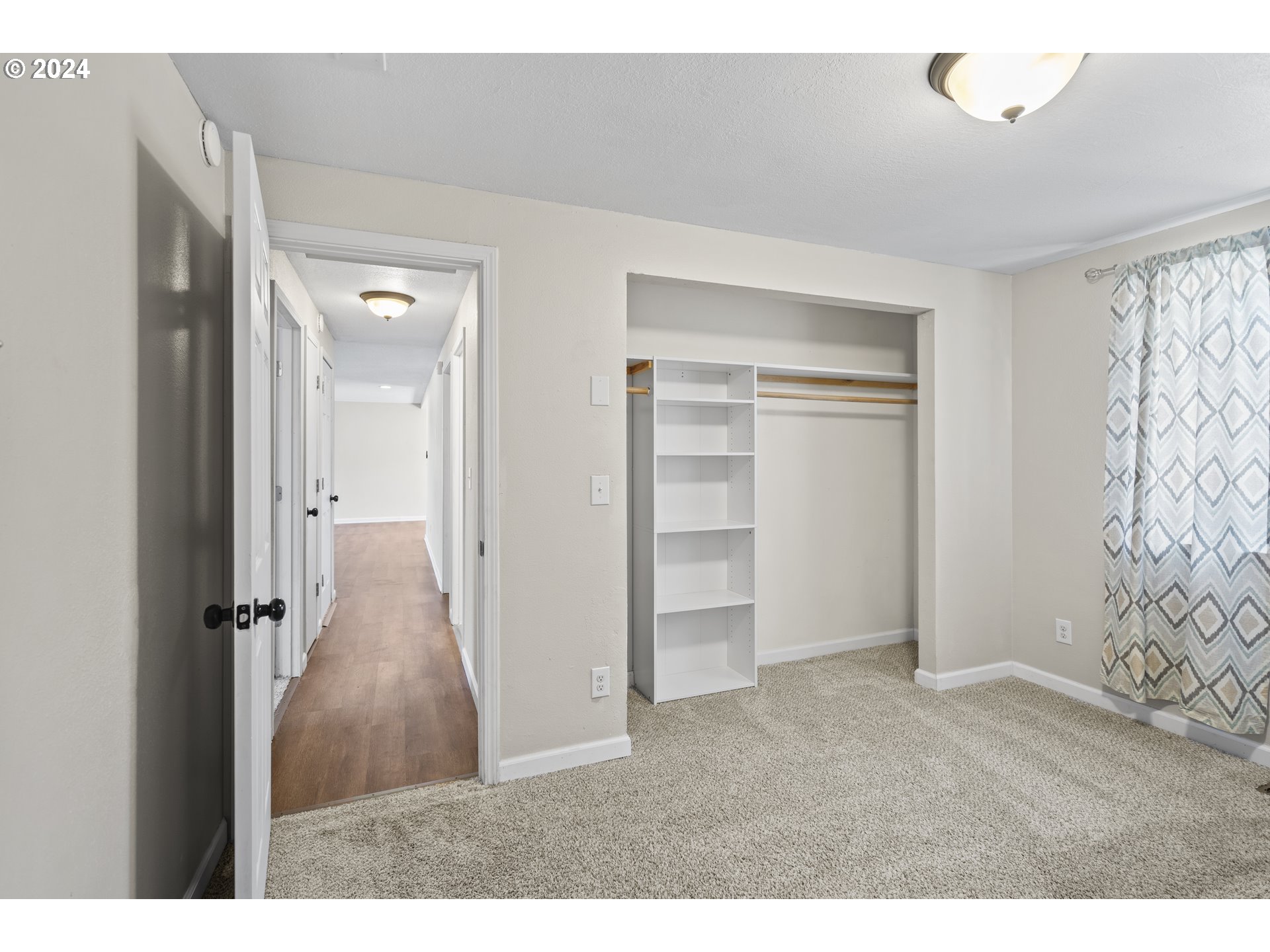 163 Christa Lane Eagle Point, OR 97524 - Photo 13 of 24 a view of a livingroom with wooden floor and closet area