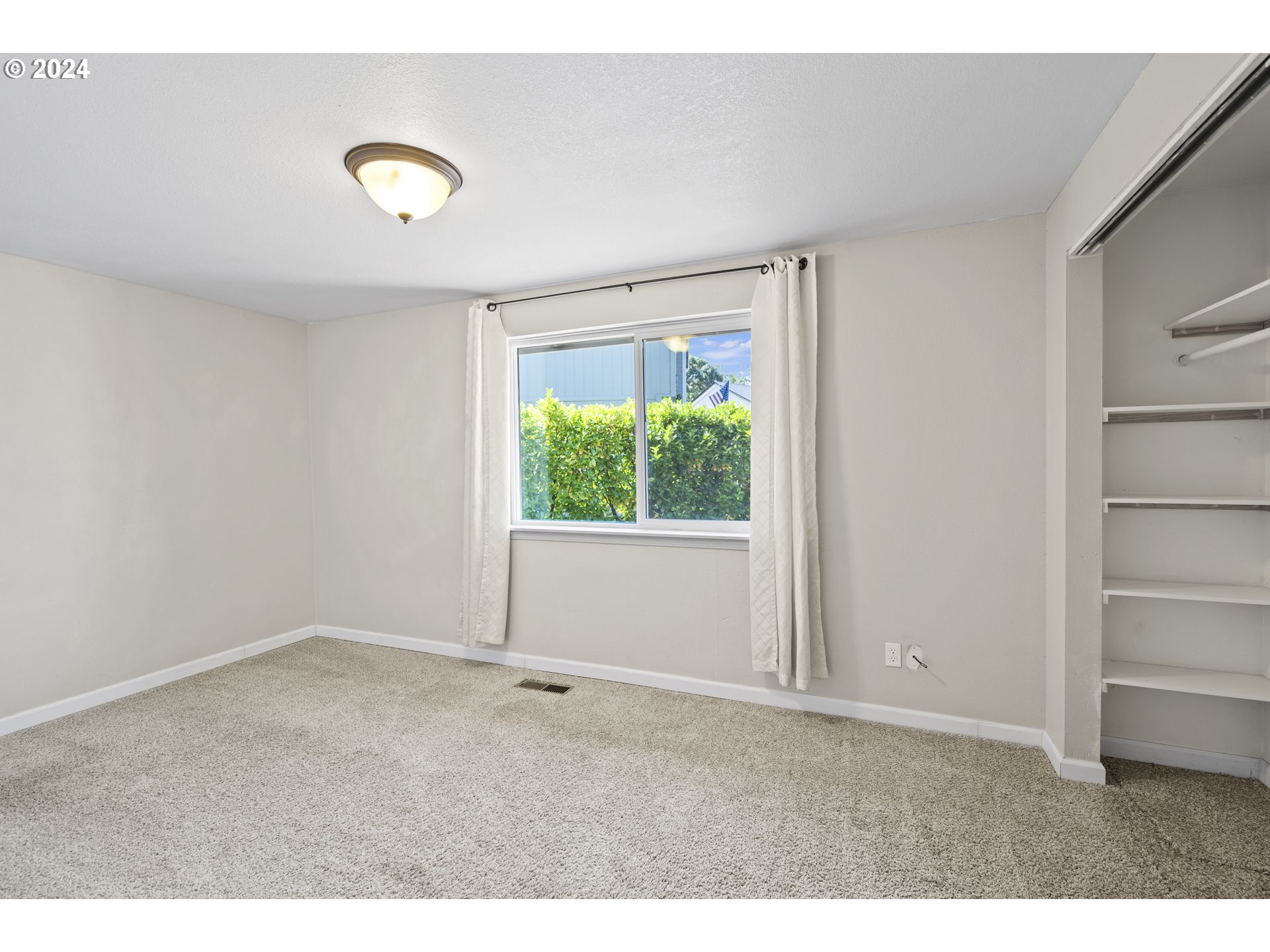 163 Christa Lane Eagle Point, OR 97524 - Photo 14 of 24 a view of an empty room with a window