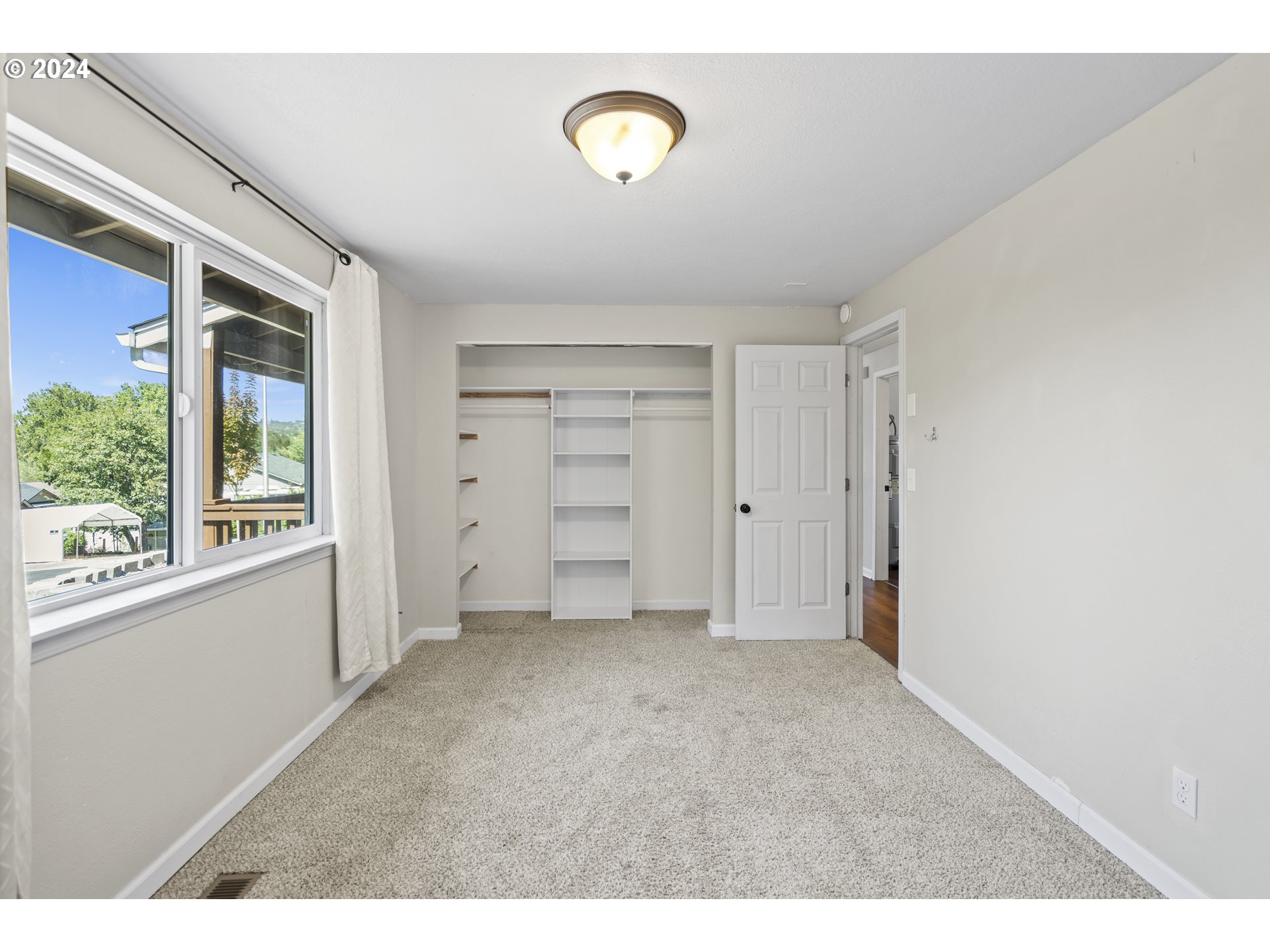 163 Christa Lane Eagle Point, OR 97524 - Photo 15 of 24 a view of an empty room with a window
