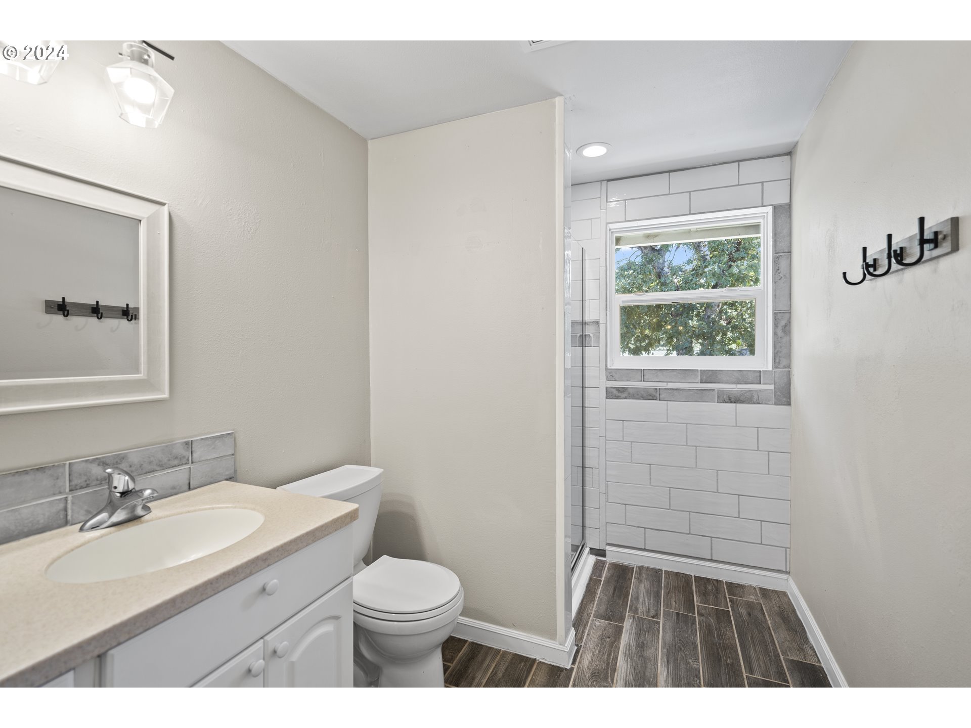 163 Christa Lane Eagle Point, OR 97524 - Photo 16 of 24 a bathroom with a granite countertop sink toilet and shower