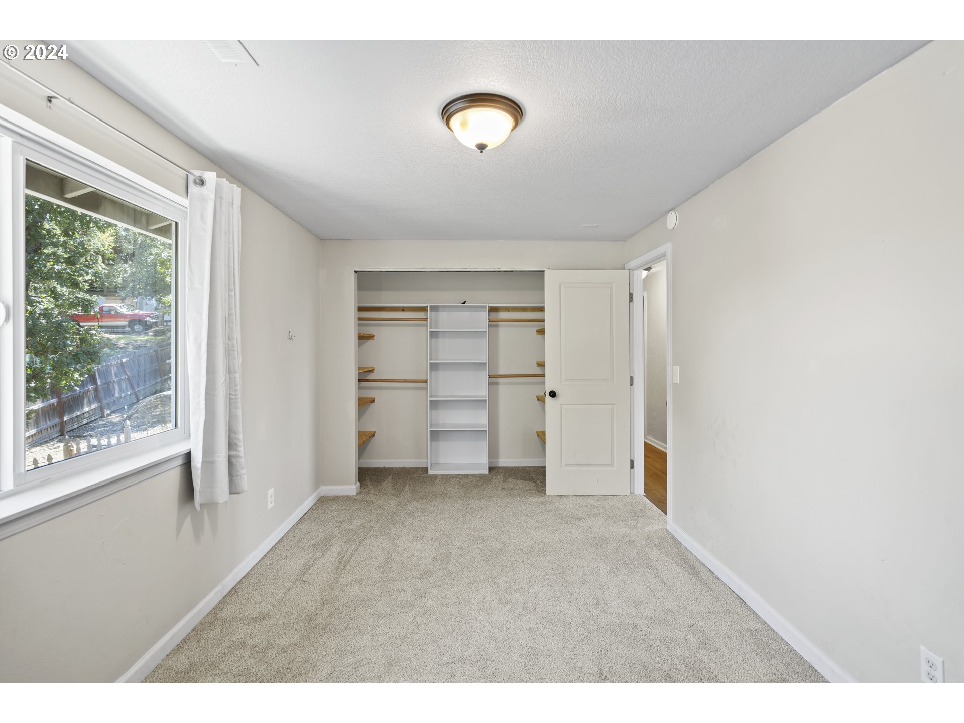 163 Christa Lane Eagle Point, OR 97524 - Photo 19 of 24 a view of an empty room with a window
