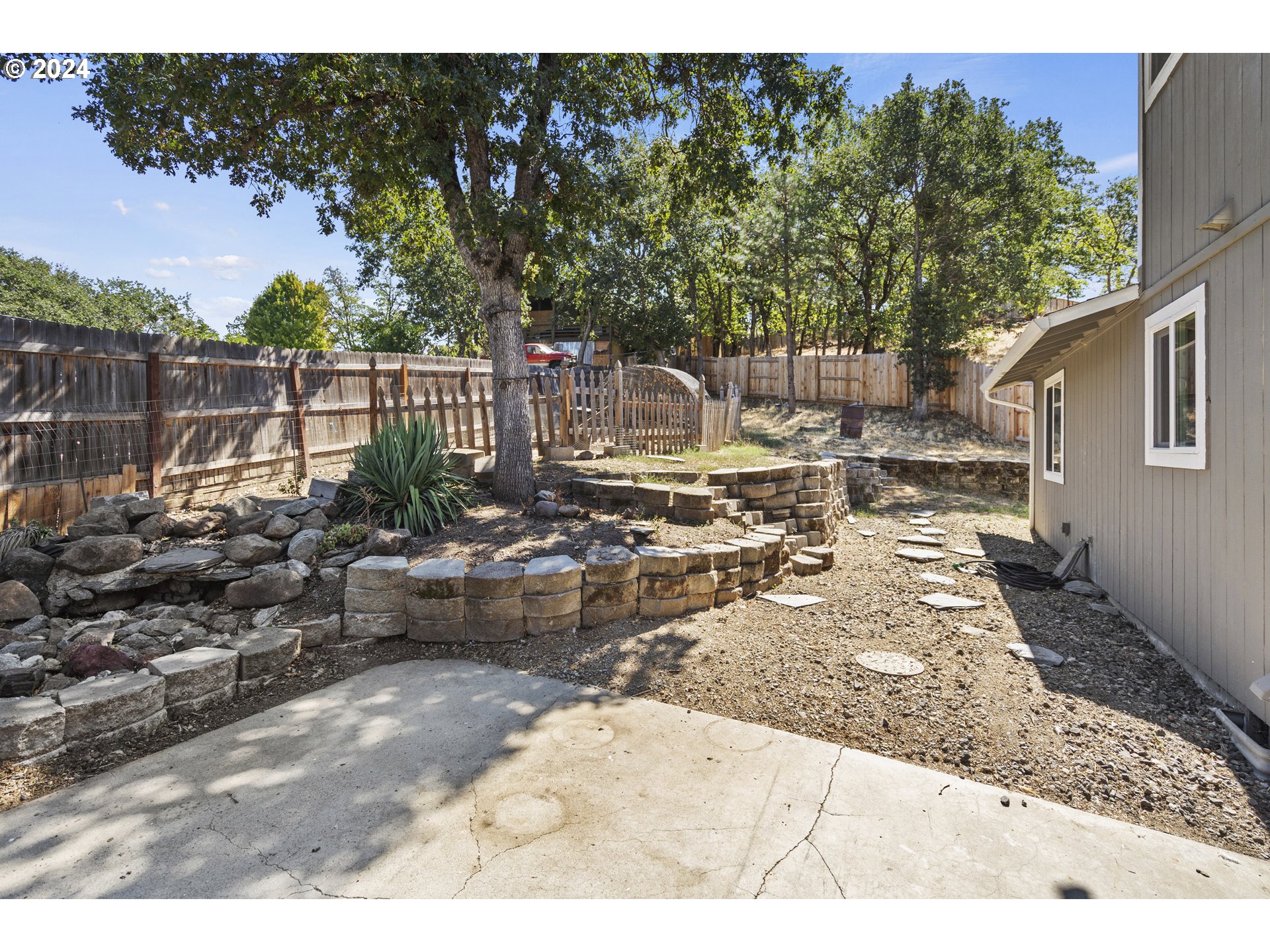 163 Christa Lane Eagle Point, OR 97524 - Photo 22 of 24 a view of a backyard with sitting area