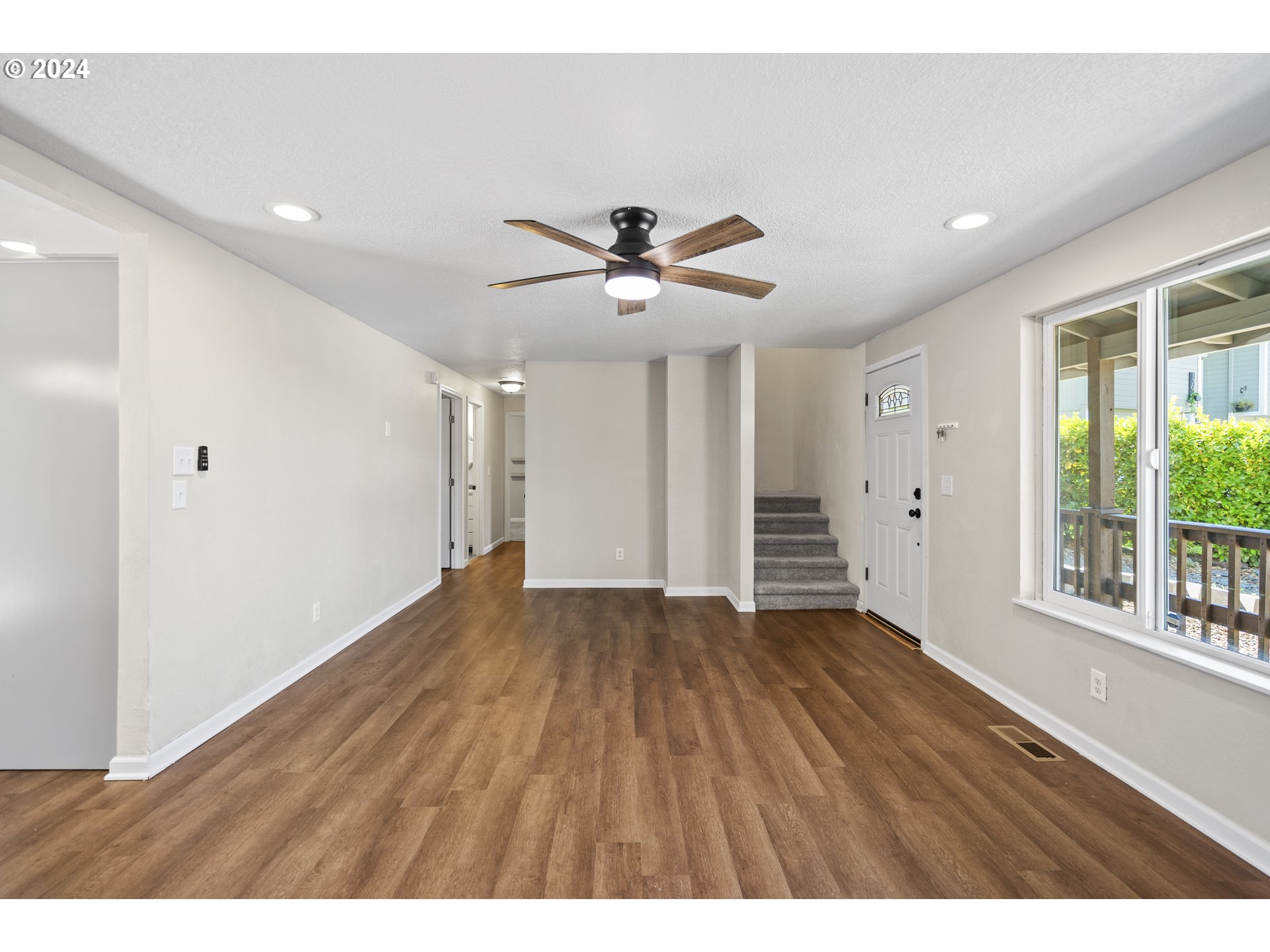 163 Christa Lane Eagle Point, OR 97524 - Photo 5 of 24 a view of empty room with wooden floor and fan