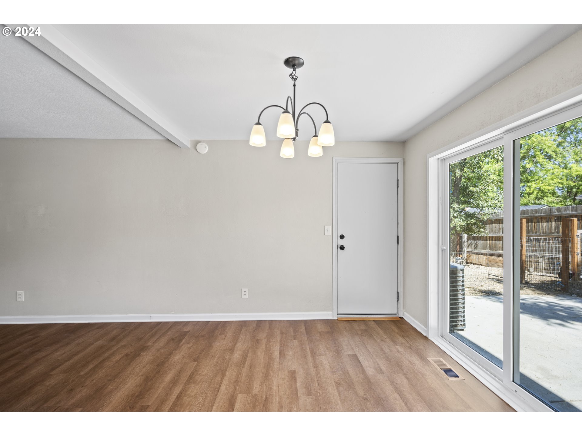 163 Christa Lane Eagle Point, OR 97524 - Photo 7 of 24 a view interior of a house with wooden floor windows and a chandelier