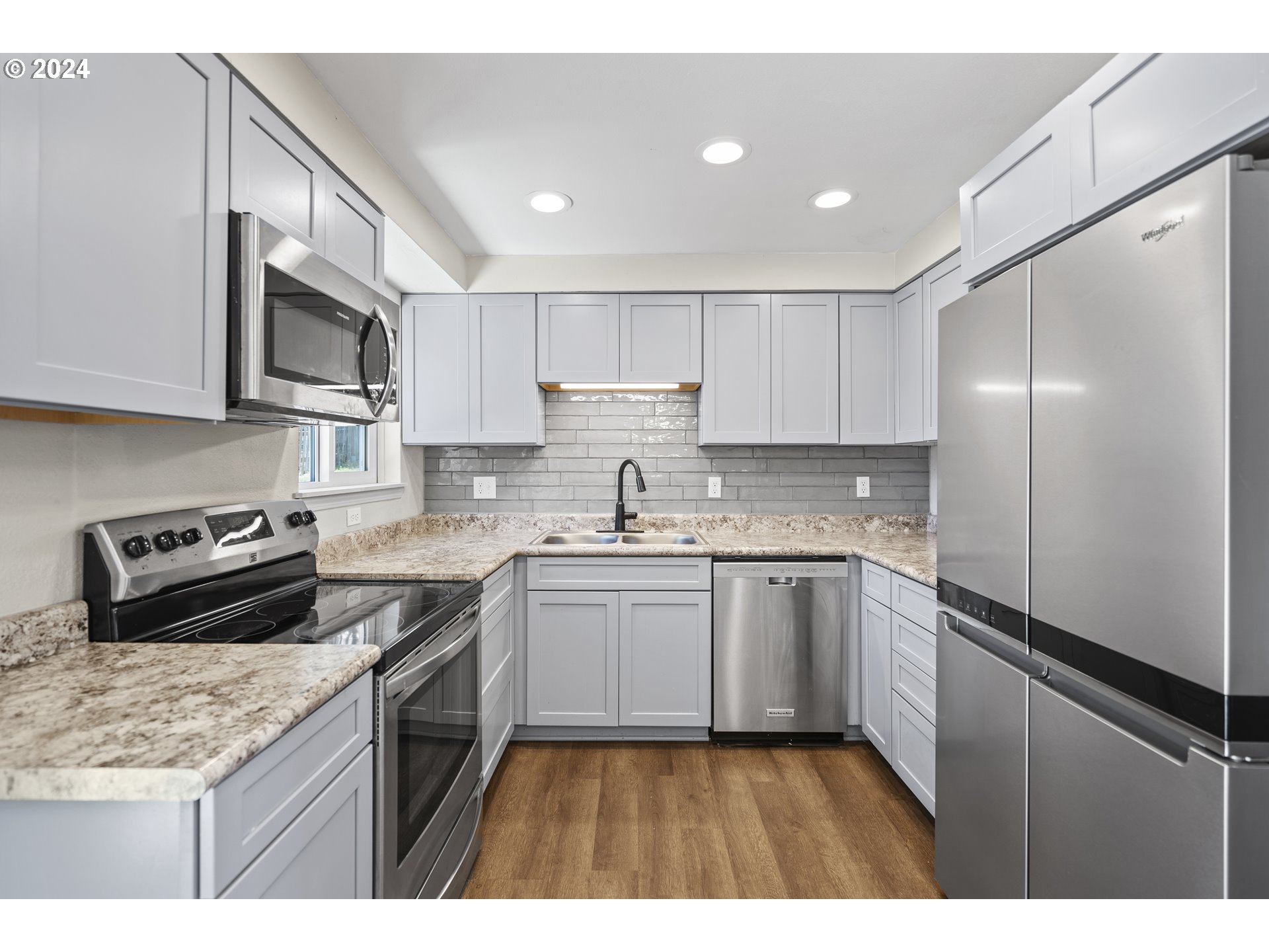 163 Christa Lane Eagle Point, OR 97524 - Photo 8 of 24 a kitchen with stainless steel appliances granite countertop a sink stove and refrigerator