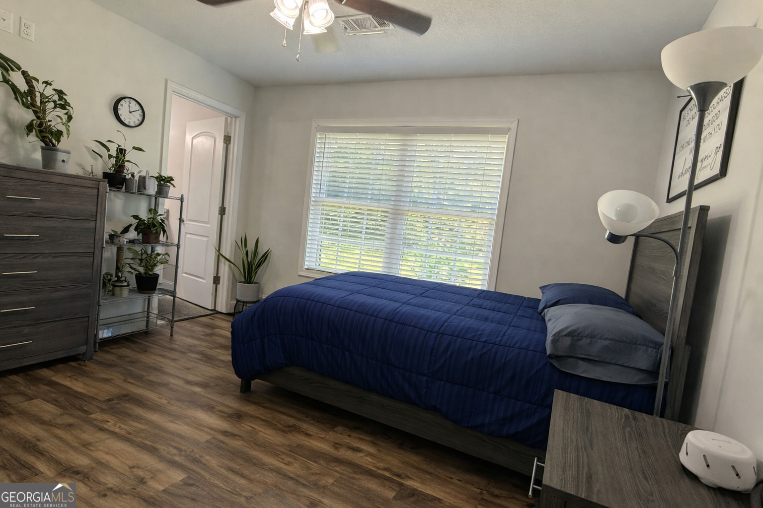 365 Quail Lane Alston, GA 30473 - Photo 4 of 9 a bedroom with a bed and a chandelier