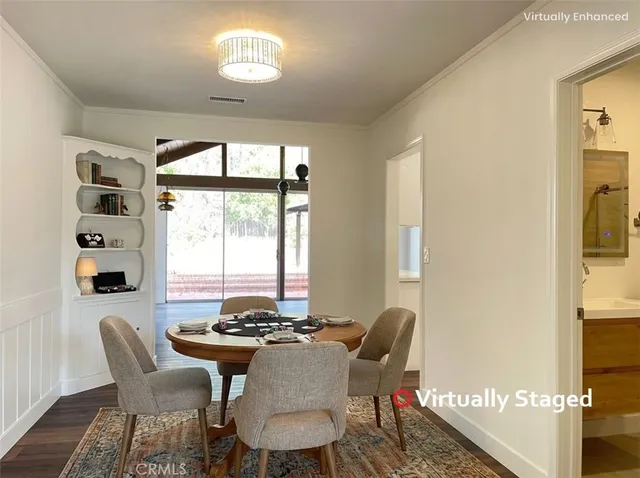 a view of a hallway with wooden floor and windows