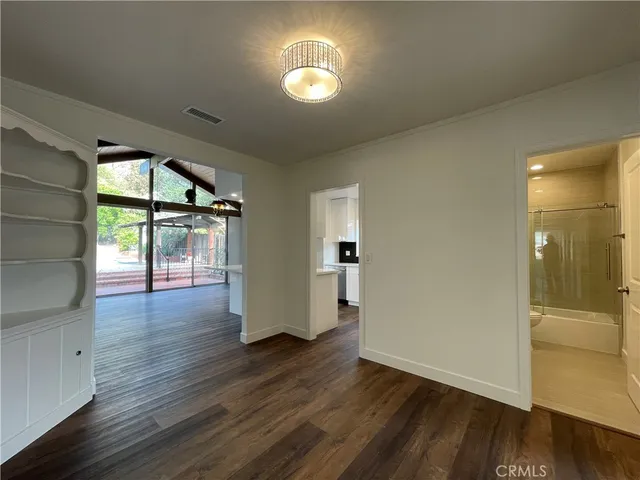 a kitchen with a sink and stainless steel appliances