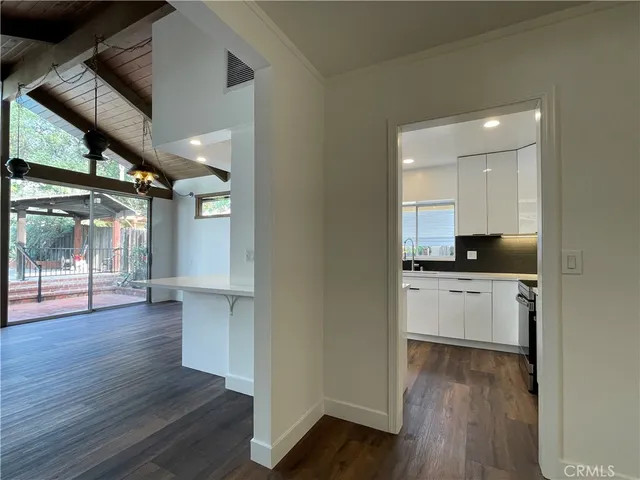 a kitchen with sink and cabinets