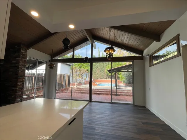 a bathroom with a shower a toilet and a sink