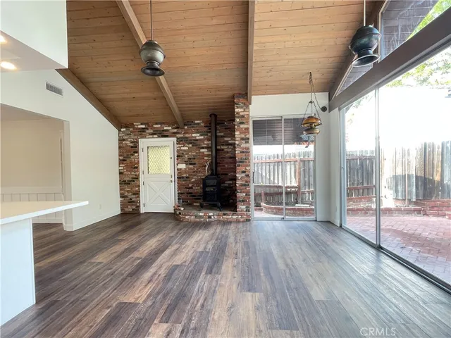 a view of the door of the house and wooden floor
