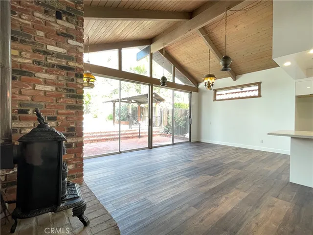 a view of kitchen with furniture and wooden floor