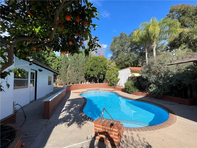 a view of a swimming pool with an outdoor space