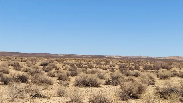 an aerial view of residential houses with city view