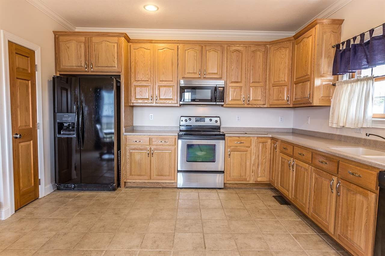 2683 Highway 30 Decatur, TN 37322 - Photo 17 of 47 a kitchen with stainless steel appliances granite countertop a refrigerator and a sink