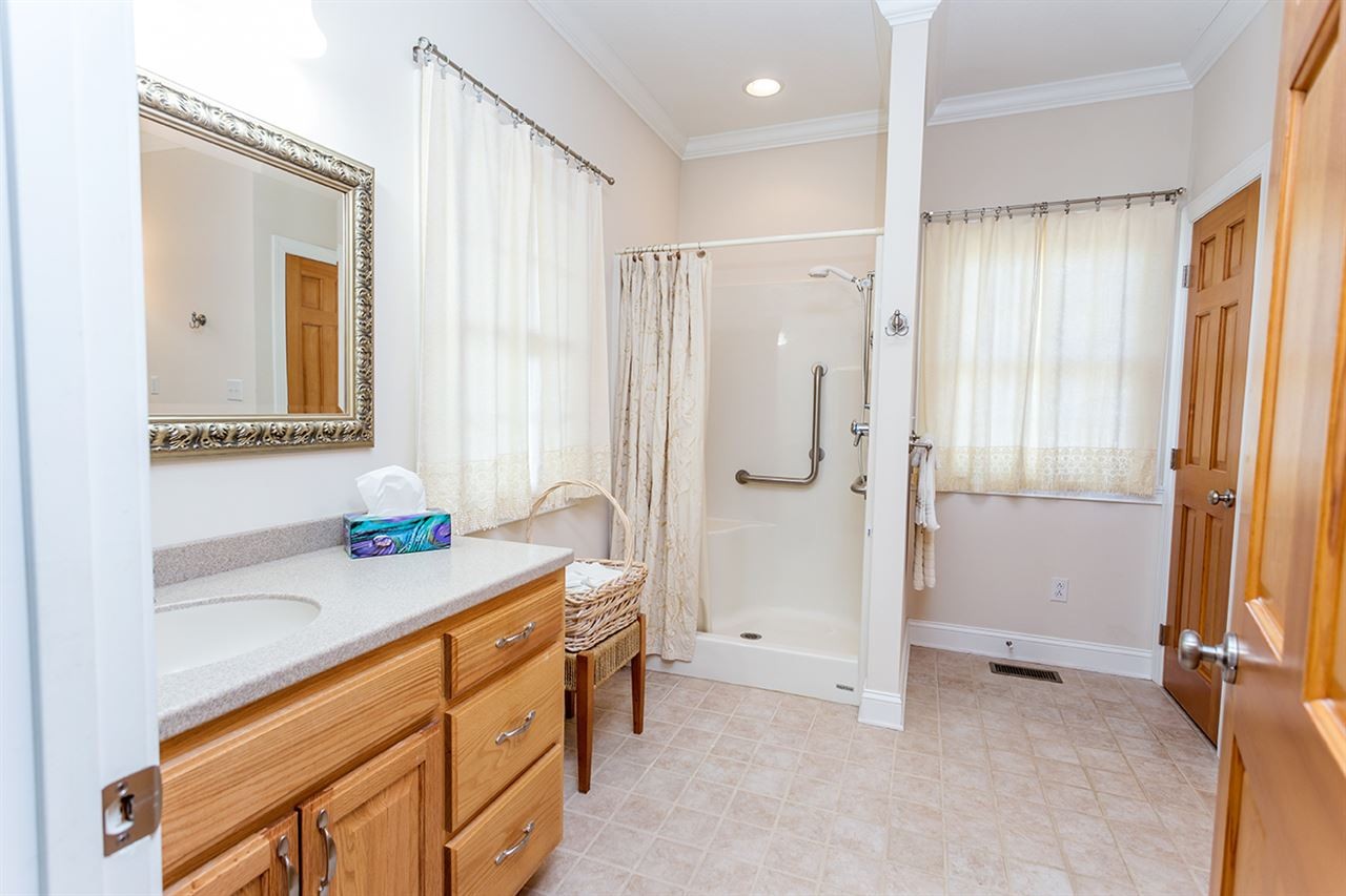 2683 Highway 30 Decatur, TN 37322 - Photo 30 of 47 a bathroom with a double sink shower and a mirror