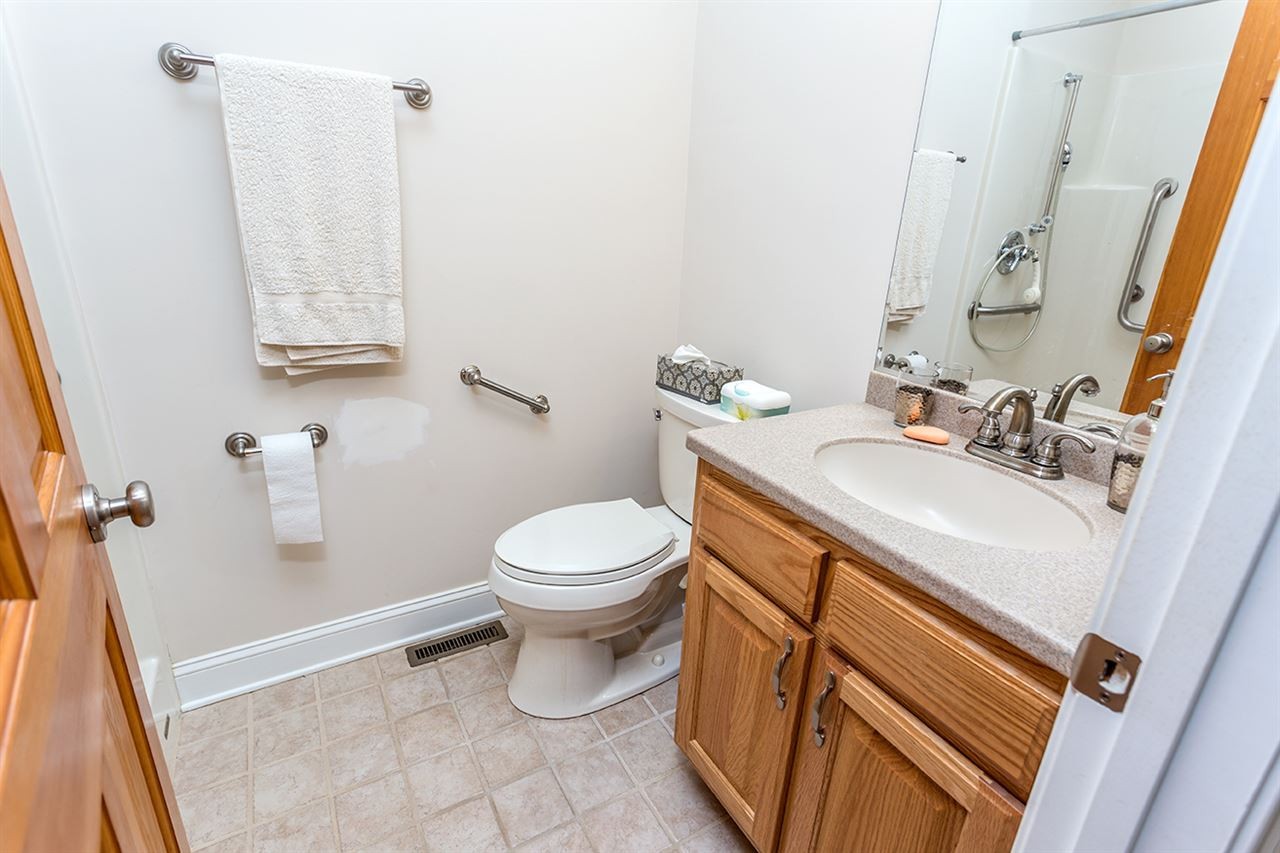 2683 Highway 30 Decatur, TN 37322 - Photo 34 of 47 a bathroom with a sink a toilet and vanity