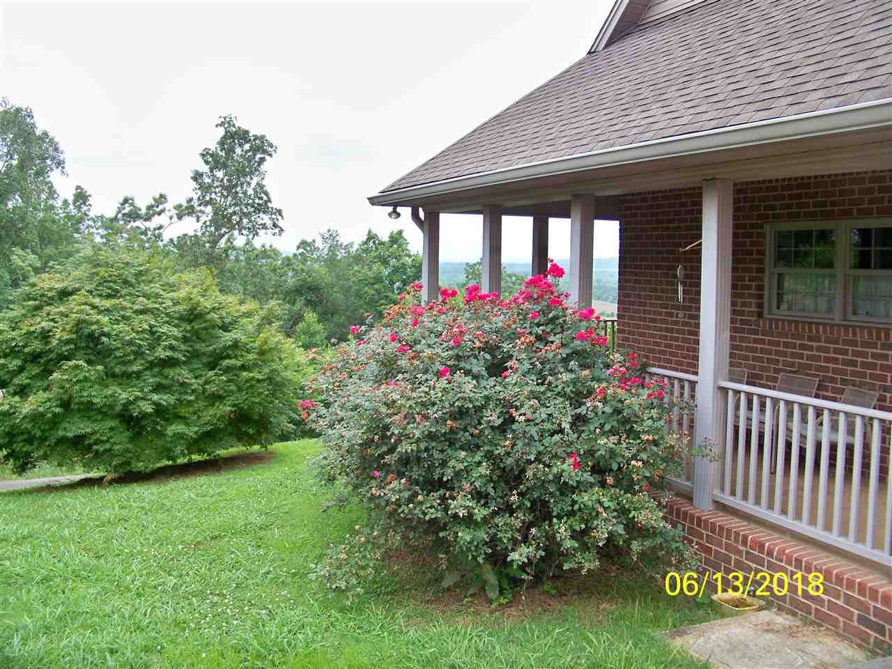 2683 Highway 30 Decatur, TN 37322 - Photo 5 of 47 a front view of a house having yard