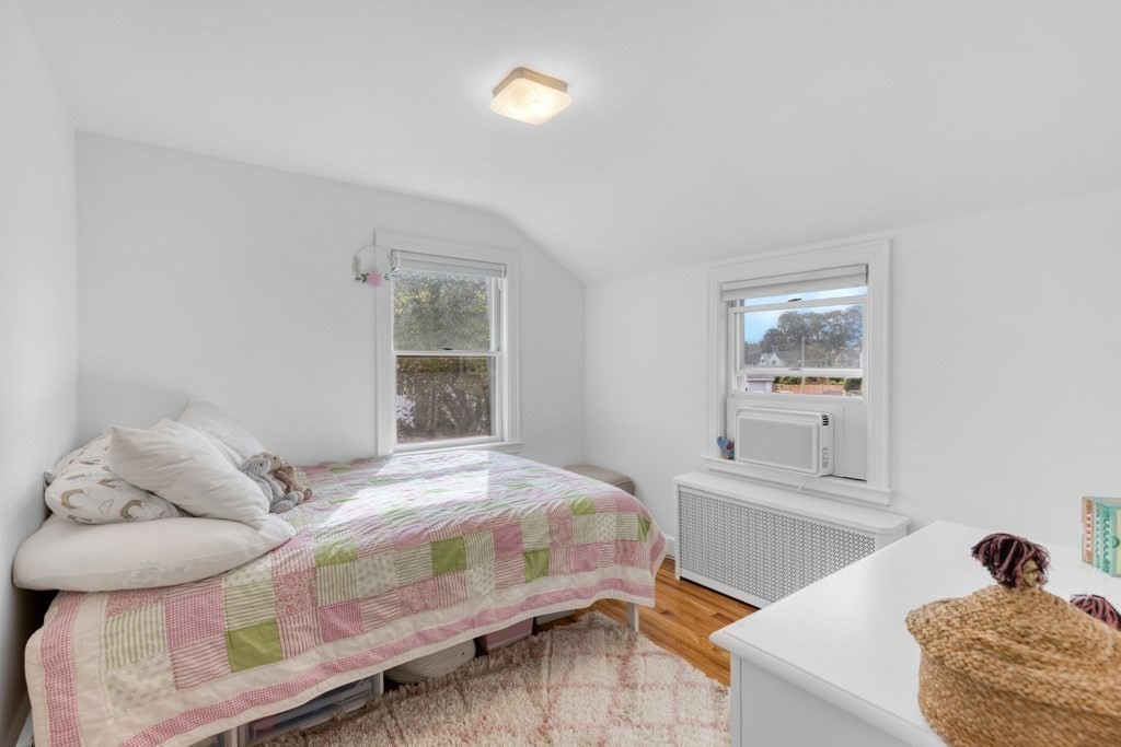 4 Rice Road Quincy, MA 02170 - Photo 17 of 26 a bedroom with a bed and window
