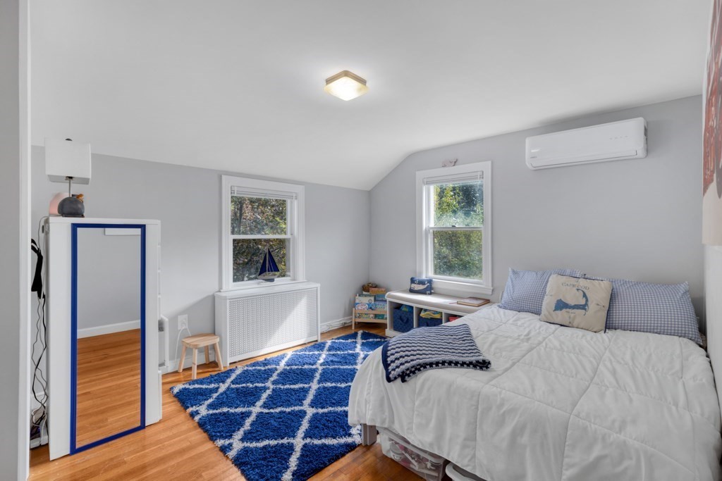 4 Rice Road Quincy, MA 02170 - Photo 19 of 26 a bedroom with a bed and a window