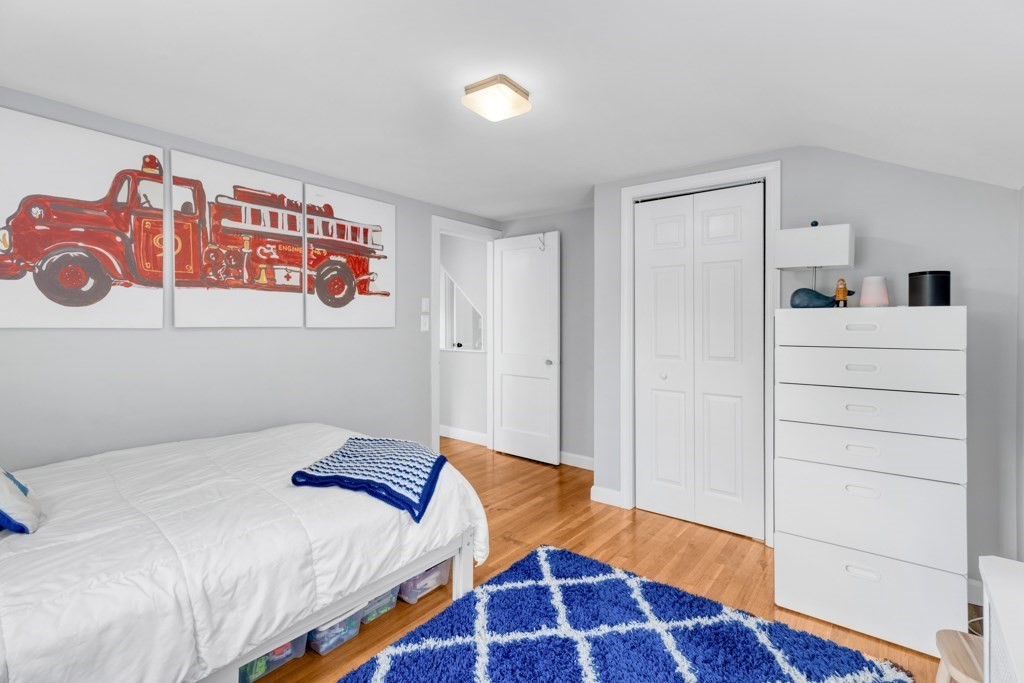 4 Rice Road Quincy, MA 02170 - Photo 20 of 26 a bedroom with a bed and a window