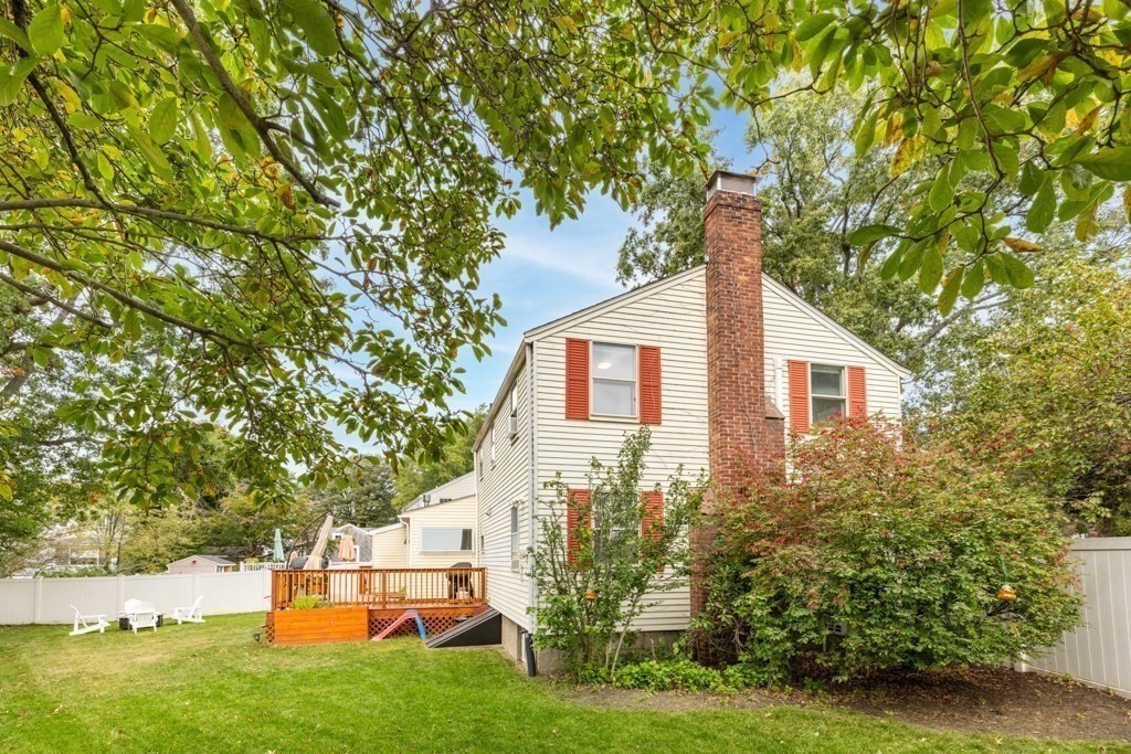 4 Rice Road Quincy, MA 02170 - Photo 4 of 26 a front view of a house with garden